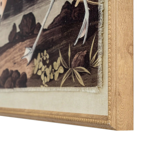Close-up of a framed piece of art with floral details and a wooden frame.