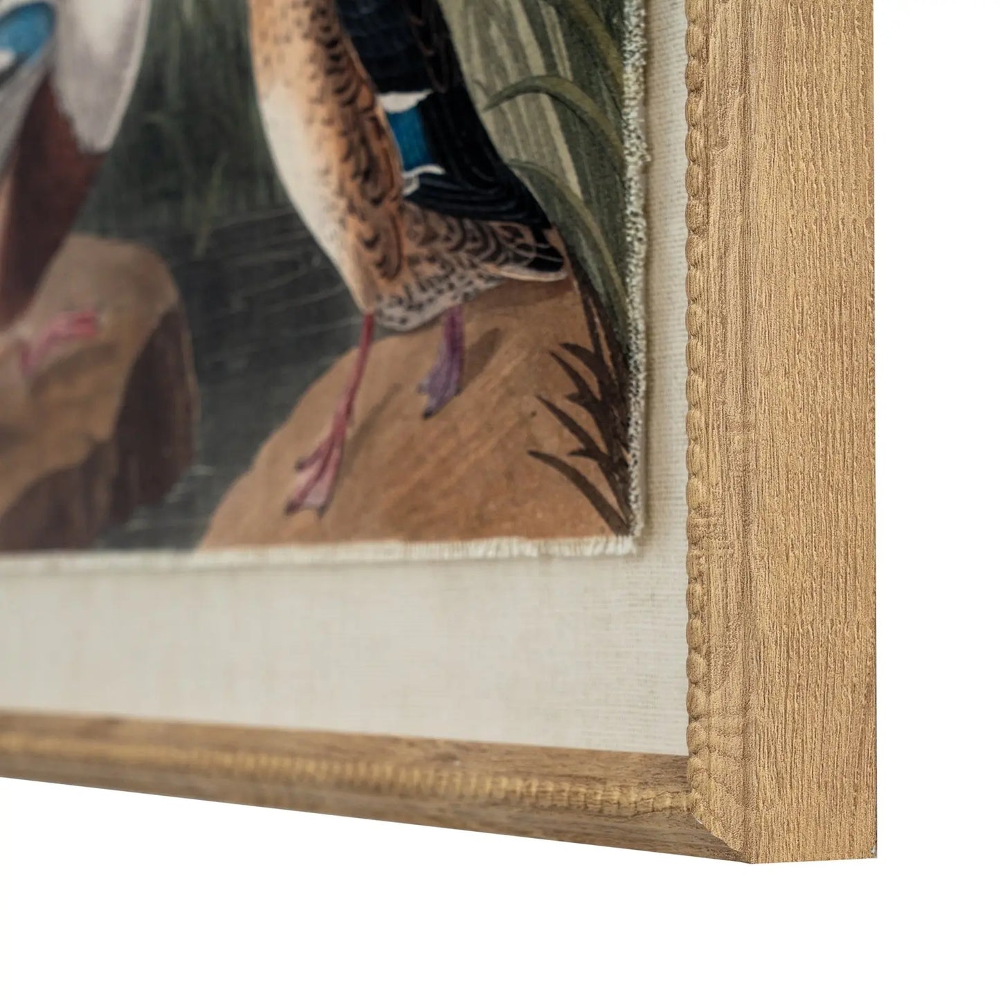 Close-up of a framed painting with a bird detail