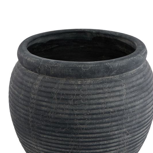 Black textured pot on a white background