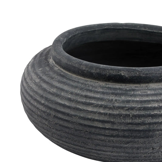 Black ribbed pot on a white background