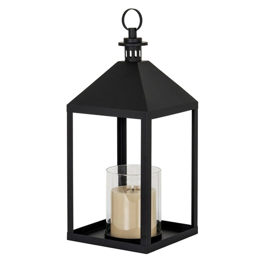 Black lantern with a candle inside on a white background