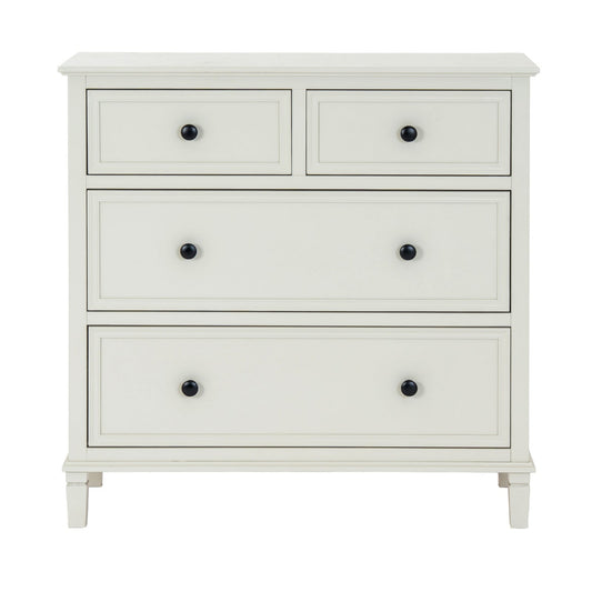 White dresser with four drawers and black knobs on a white background