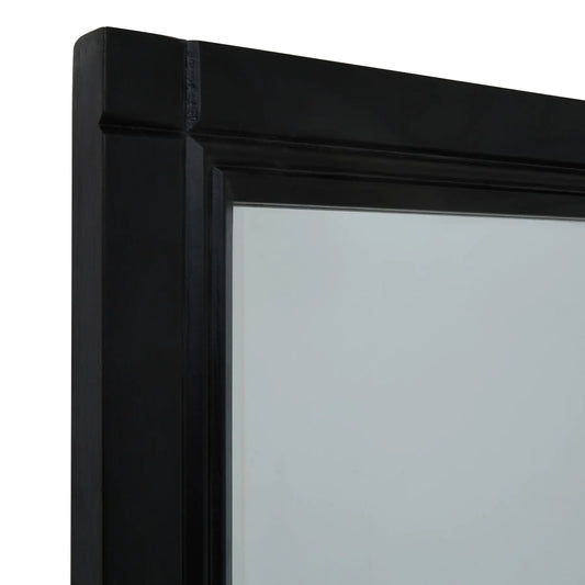Close-up of a black framed mirror corner on a white background