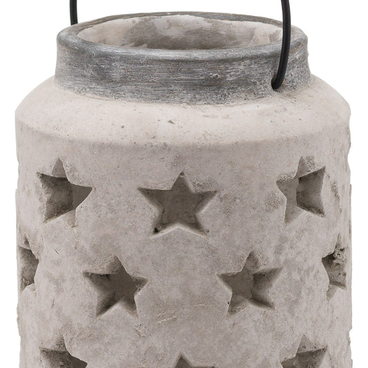 Cement lantern with star patterns on a white background