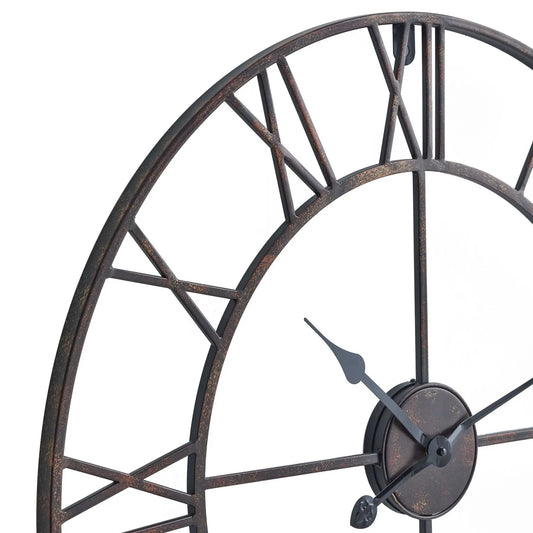 Decorative wall clock with metal design on a white background