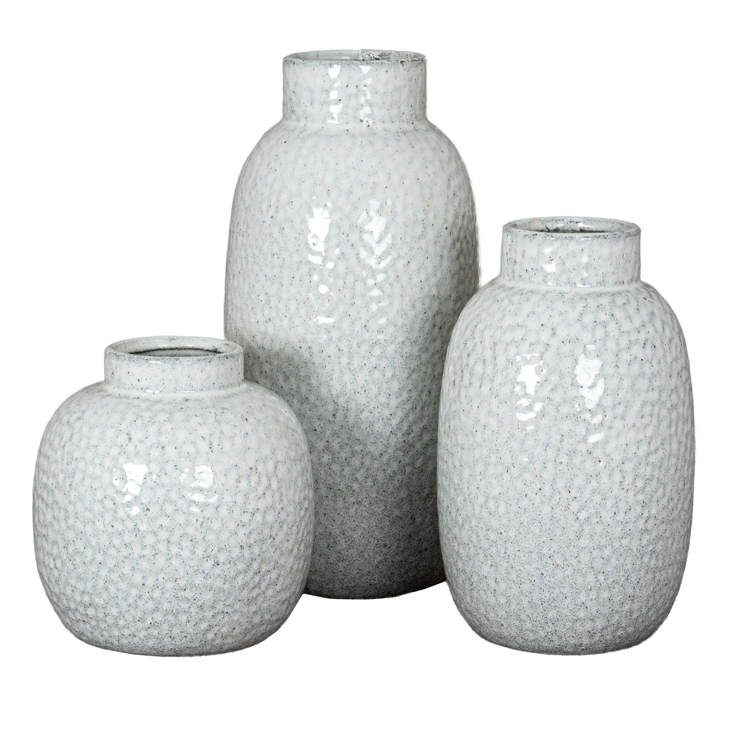 Three textured white vases of different sizes on a white background