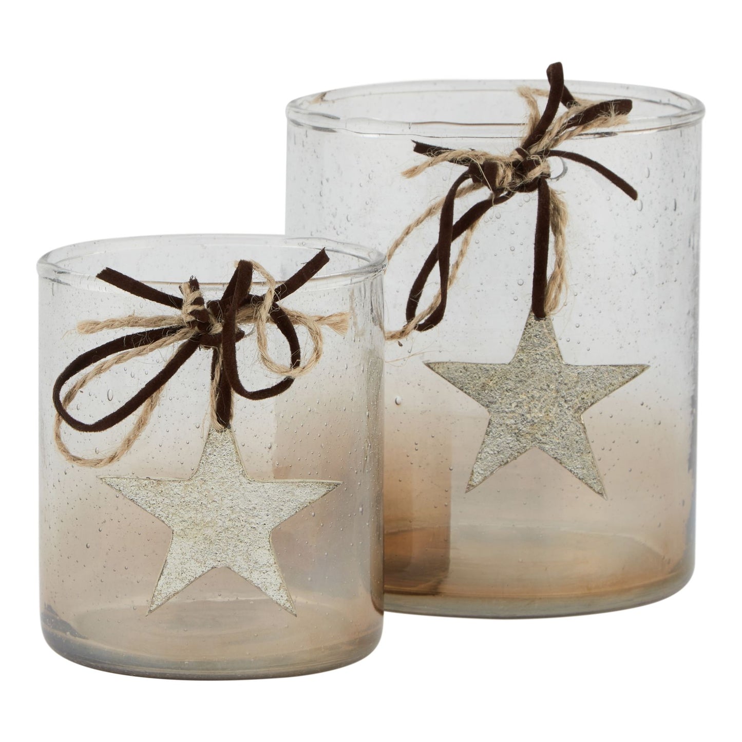 Two glass candle holders with star designs and twine bows on a white background
