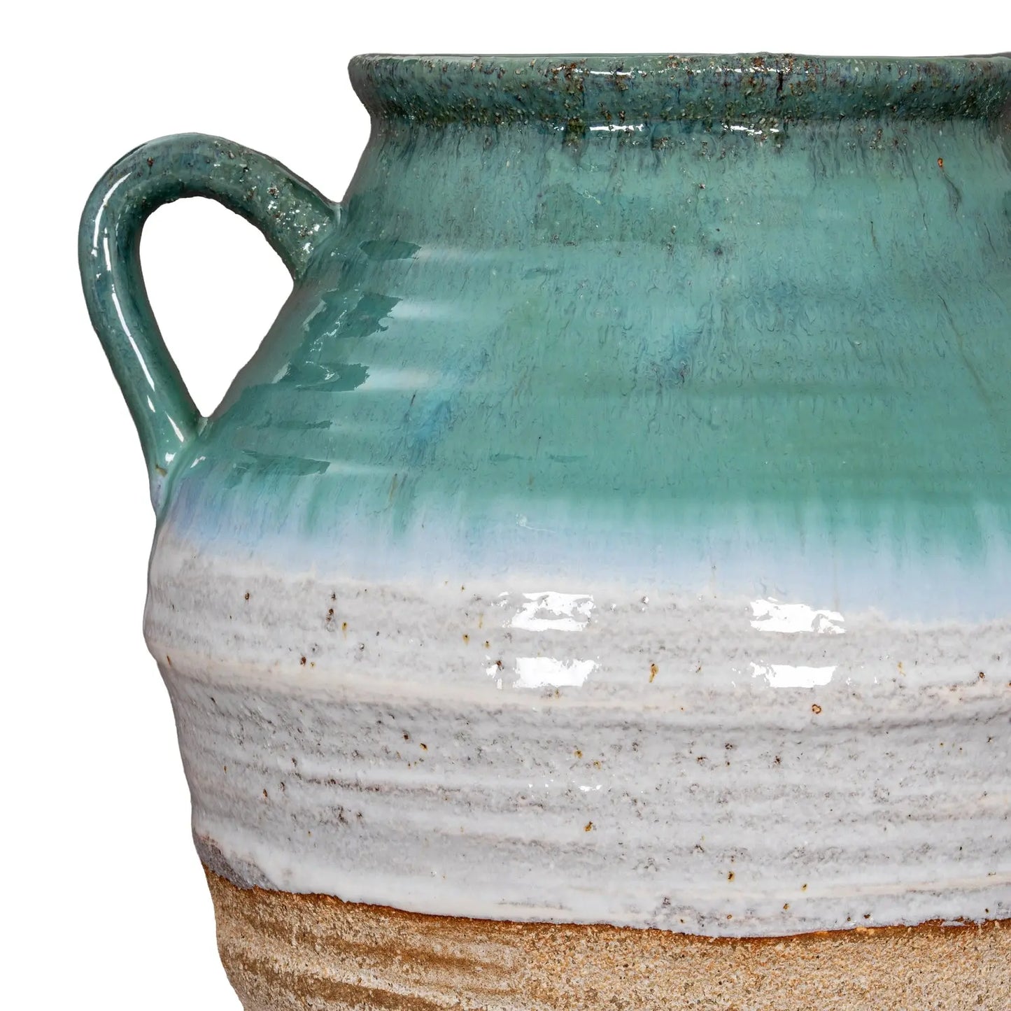 Close-up of a ceramic vase with a gradient glaze from green to beige.
