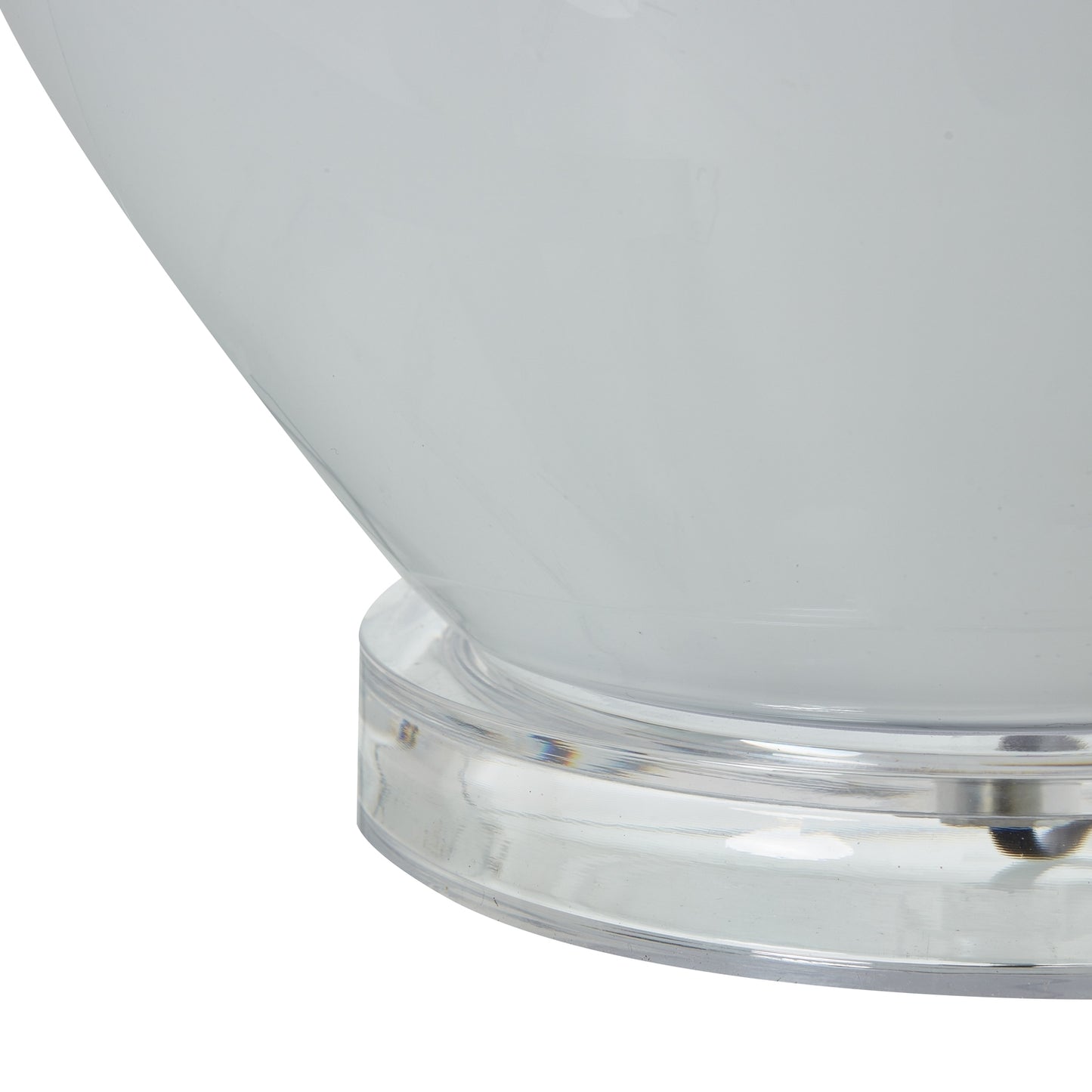 Close-up of a white bowl with a clear base on a white background