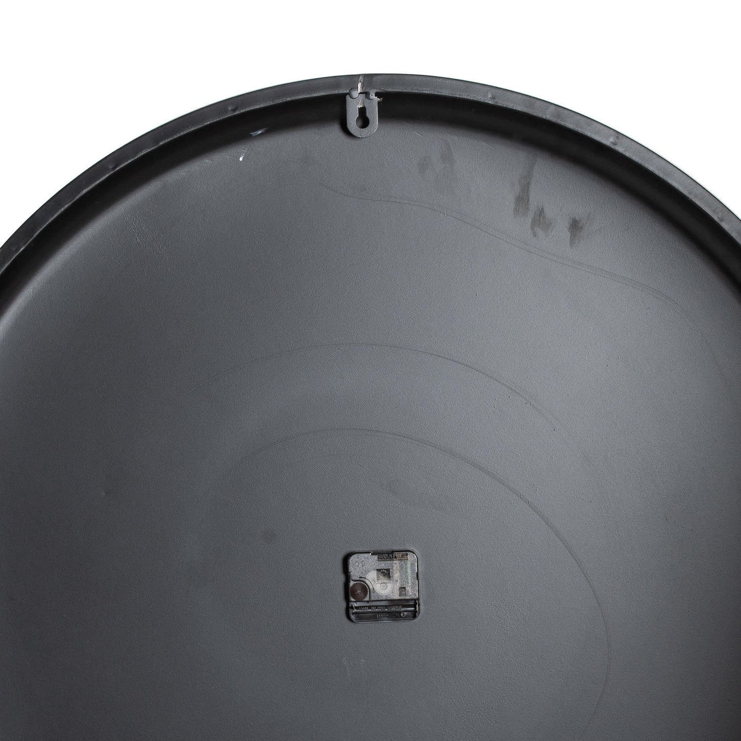 Close-up of a black plastic drum with a visible brand label on a white background