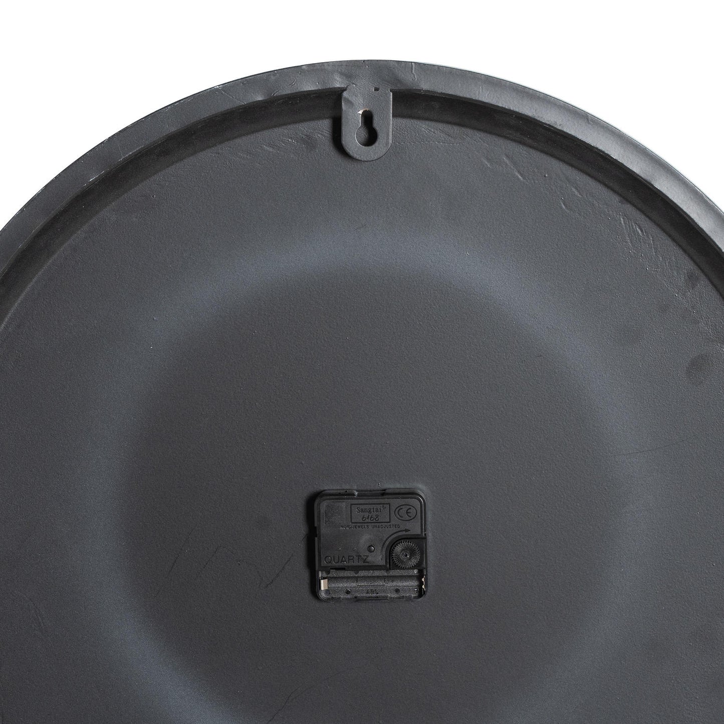 Close-up of a black plastic component on a white background