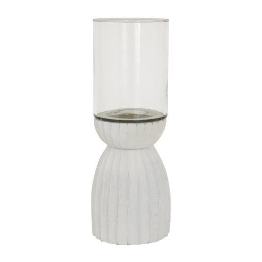 Tall glass vase with ribbed white base on a white background