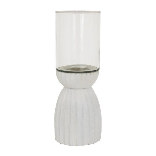 Tall glass vase with ribbed white base on a white background