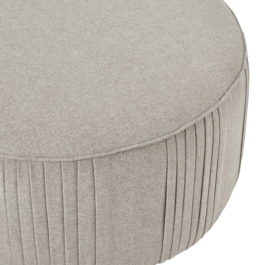 Round gray ottoman with pleated design on a white background