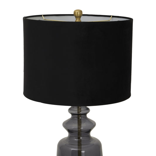 Black lamp with a dark glass base on a white background