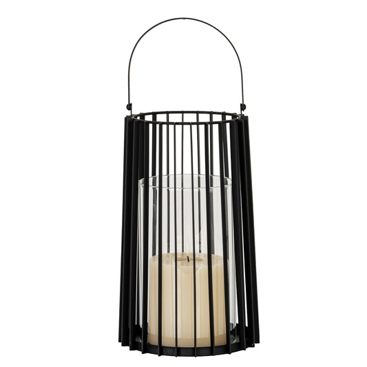 Black metal lantern with a candle inside on a white background
