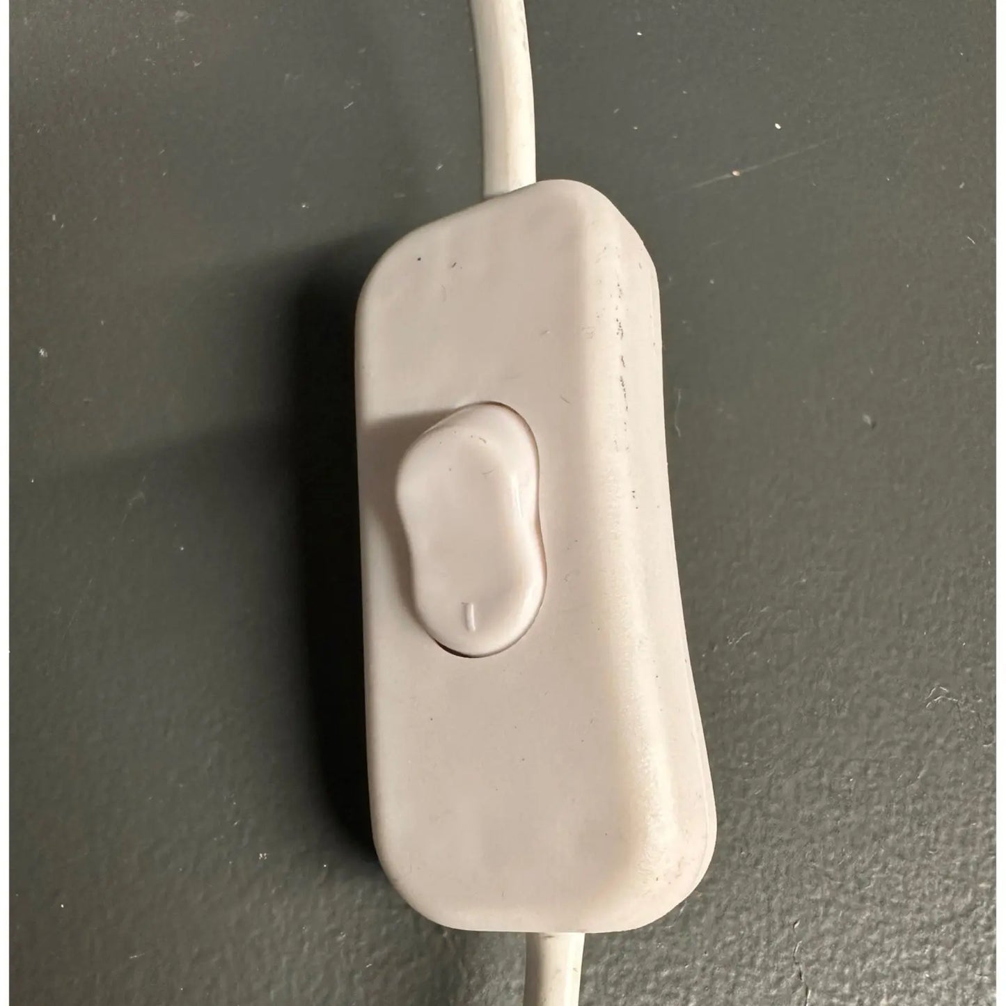 Beige electronic component on a dark gray background