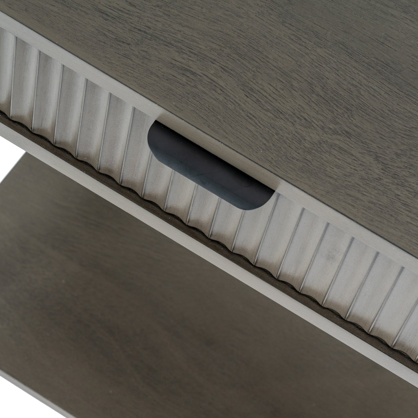 Close-up of a wooden surface with a handle and ribbed edge.