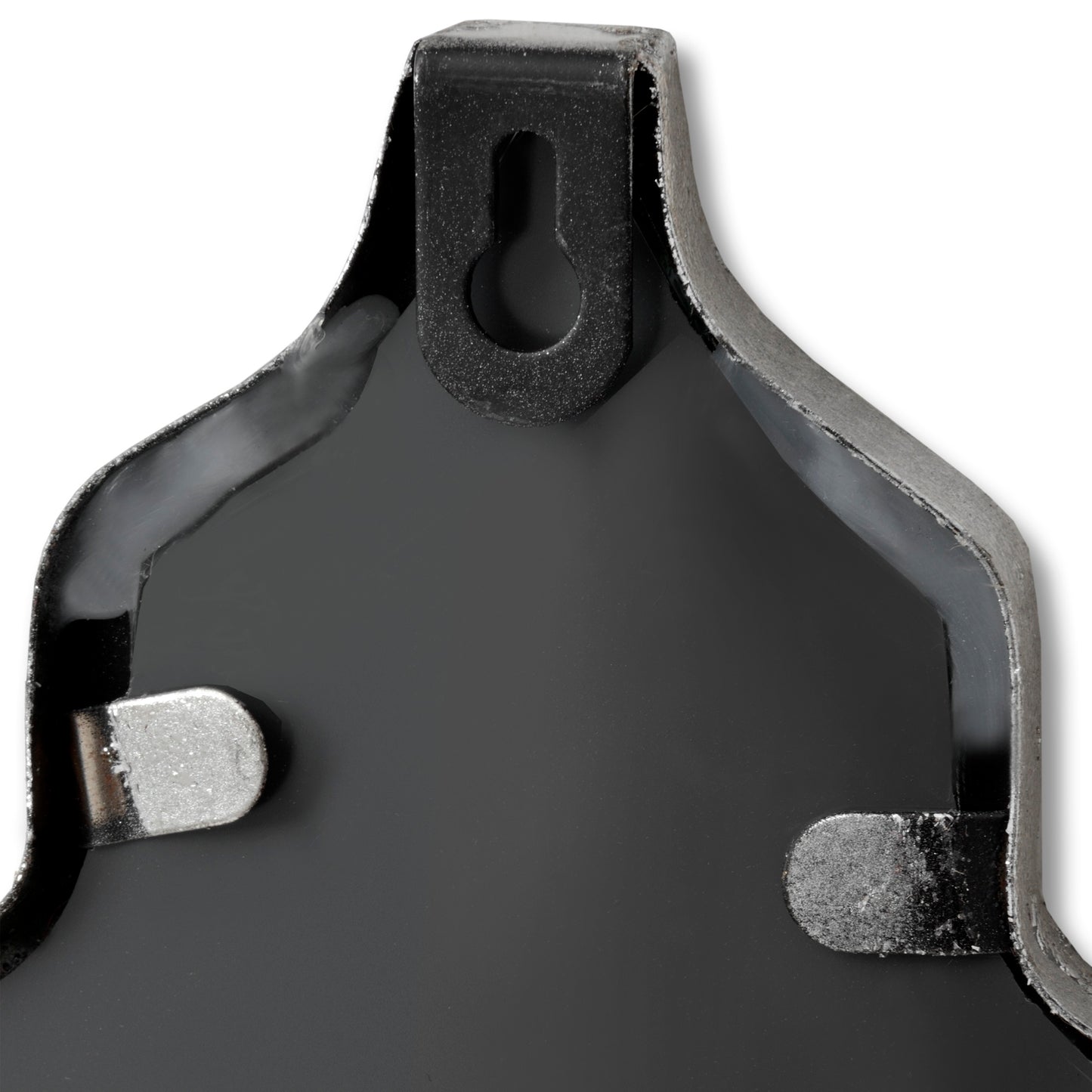 Close-up of a brake pad with metallic and rubber components on a white background