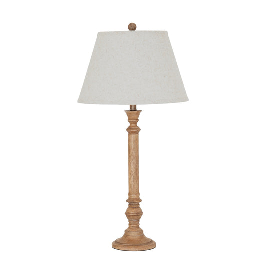 Table lamp with wooden base and white shade on a white background