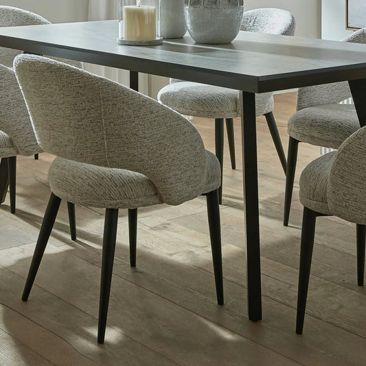 Dining table with chairs in a well-lit room