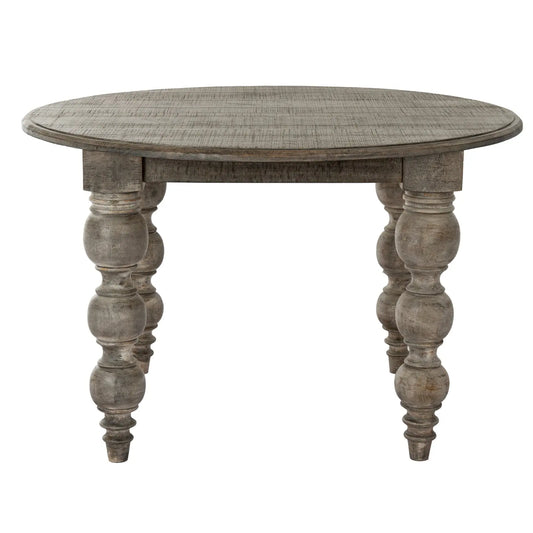 Round wooden table with turned legs on a white background