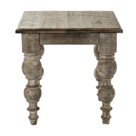 Wooden side table with turned legs on a white background