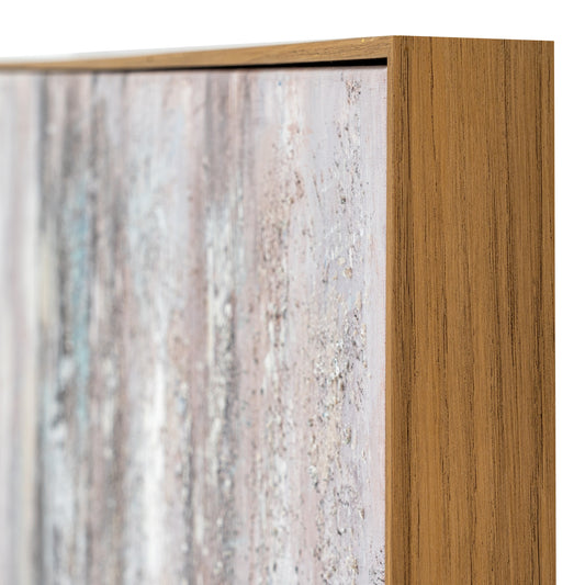 Close-up of a wooden frame with a textured panel