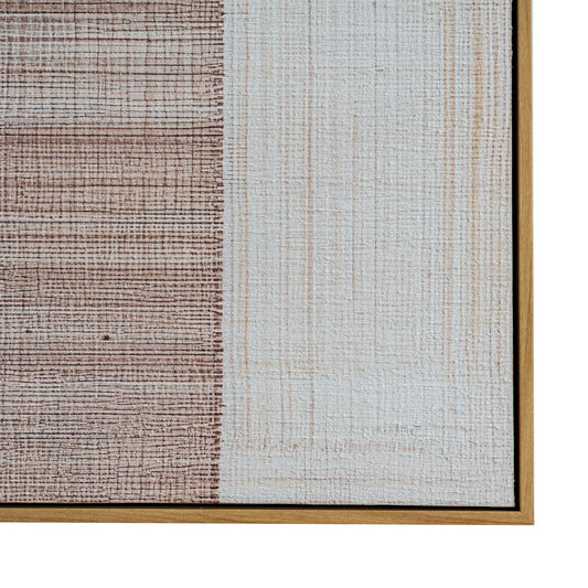 Textured wall art with a gold frame on a white background