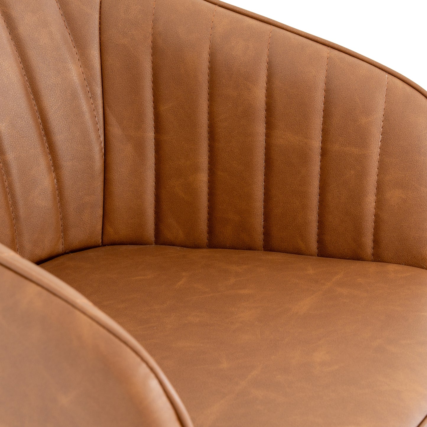 Close-up of a brown leather chair with visible stitching