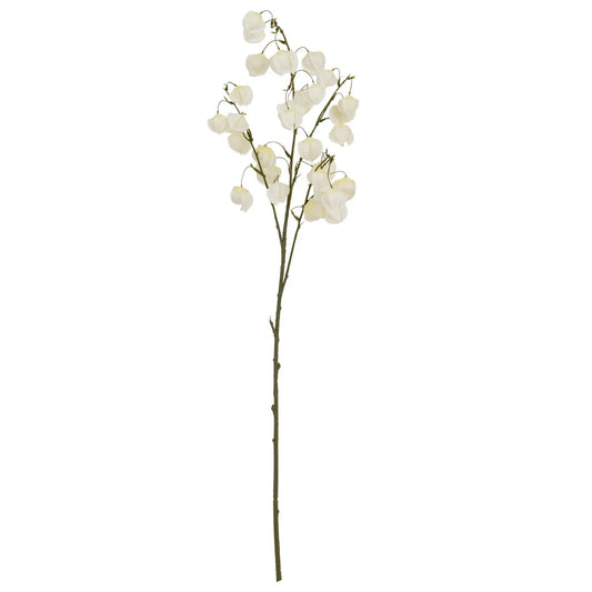 Artificial flower branch with white flowers on a white background