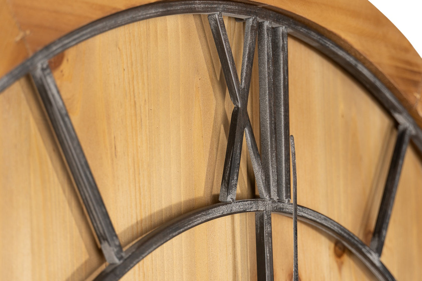 Wooden clock with metal Roman numeral accents on a wooden background