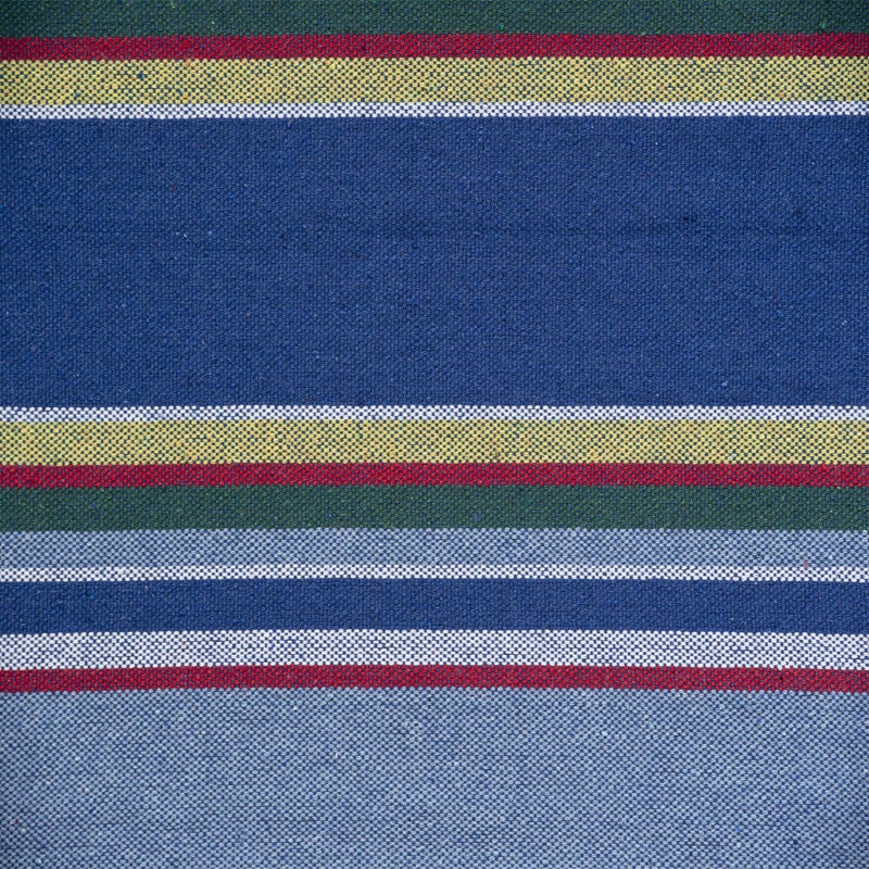 Close-up of fabric with multicolored stripes on a blue background