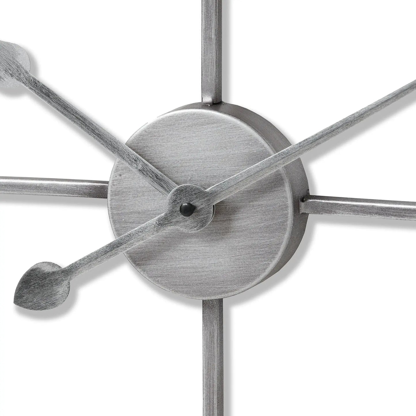 Close-up of a metallic wall clock with star-shaped design on a white background