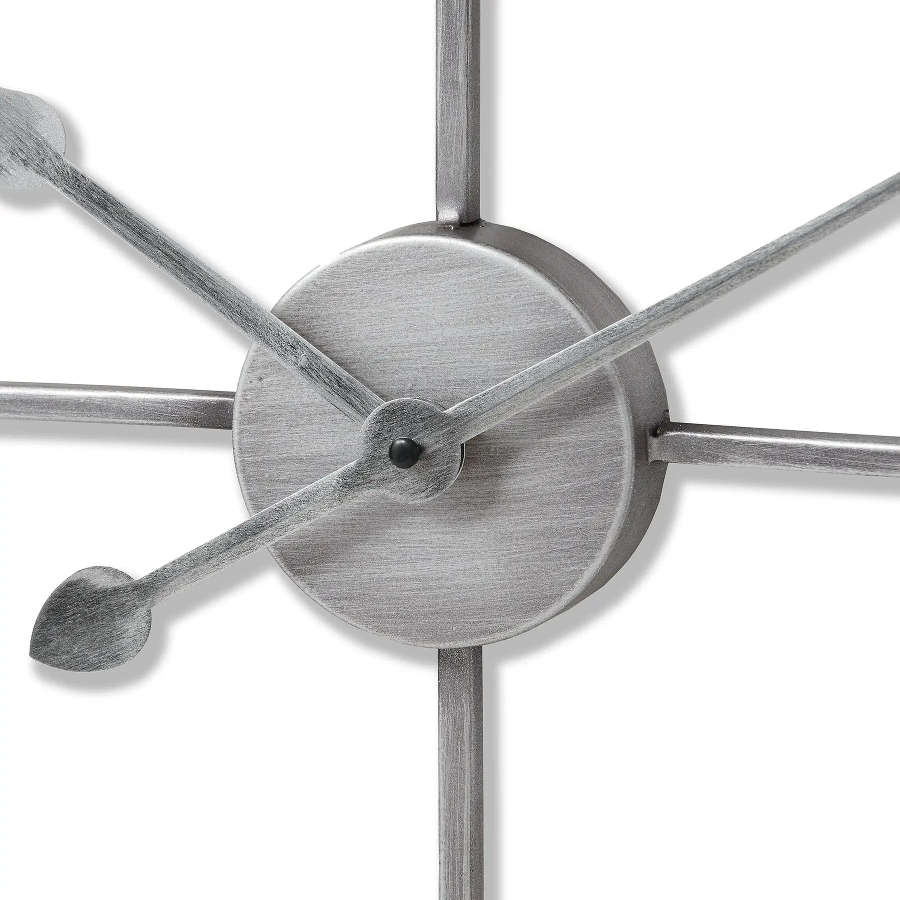 Close-up of a metallic wall clock with star-shaped design on a white background