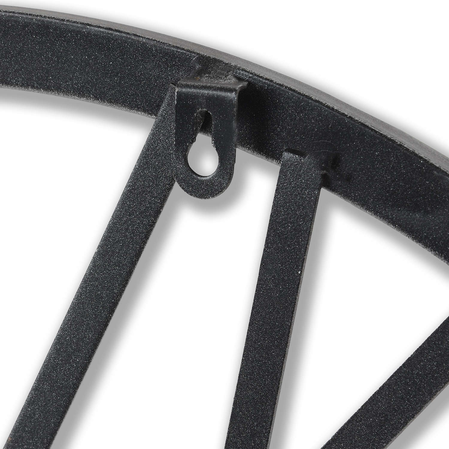 Close-up of a black metal decorative bracket on a white background