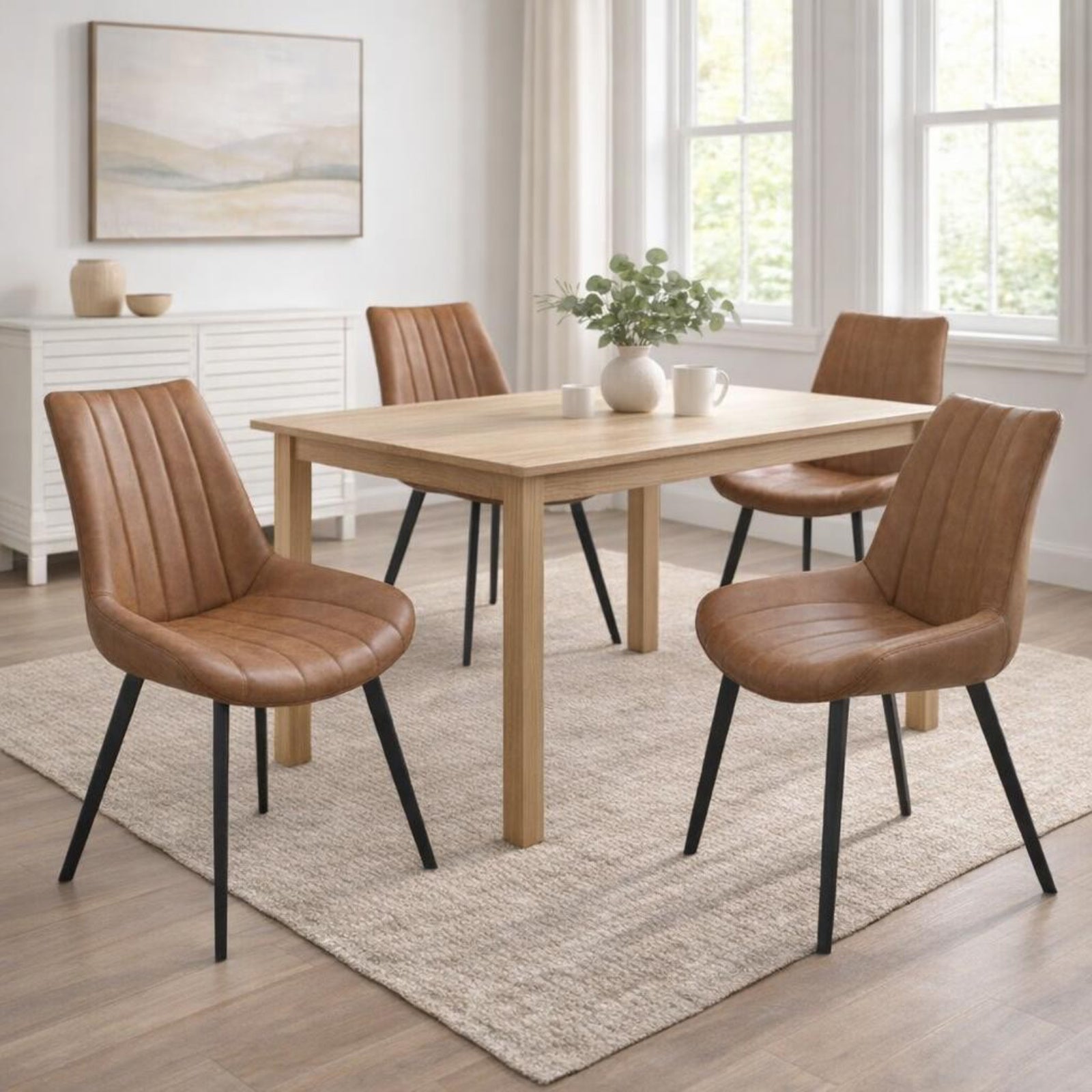 Dining room with wooden table and brown chairs in a bright room.