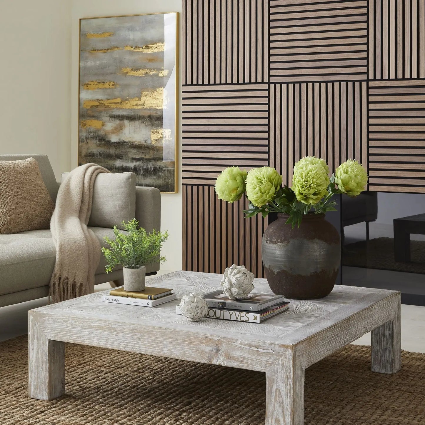 Living room with a wooden coffee table, sofa, and decorative elements.
