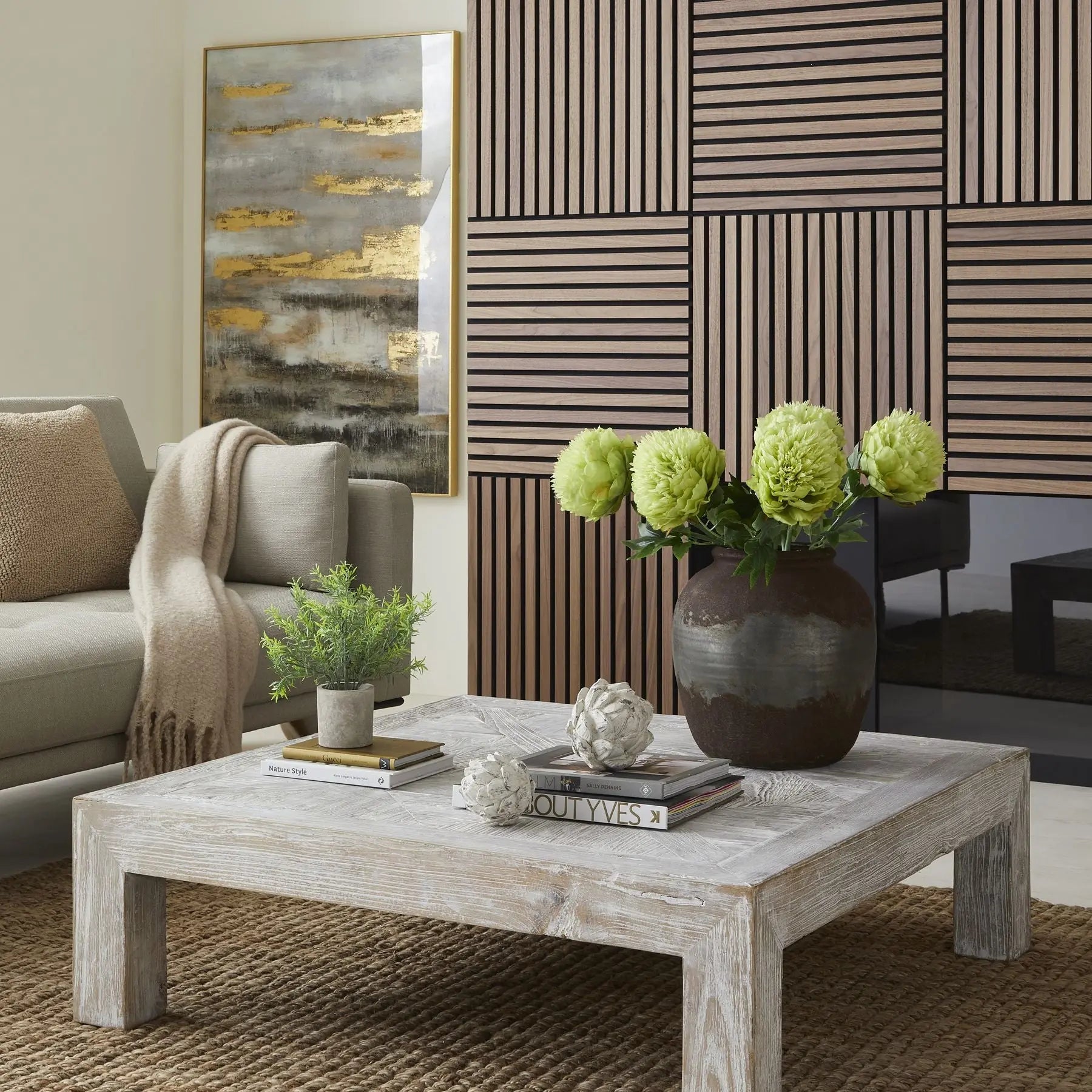 Living room with a wooden coffee table, sofa, and decorative elements.