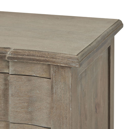 Close-up of a wooden sideboard with a light brown finish.