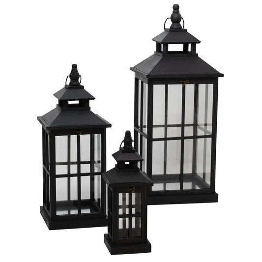 Set of three black lanterns on a white background