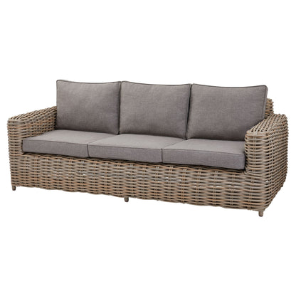 Wicker outdoor sofa with gray cushions on a white background