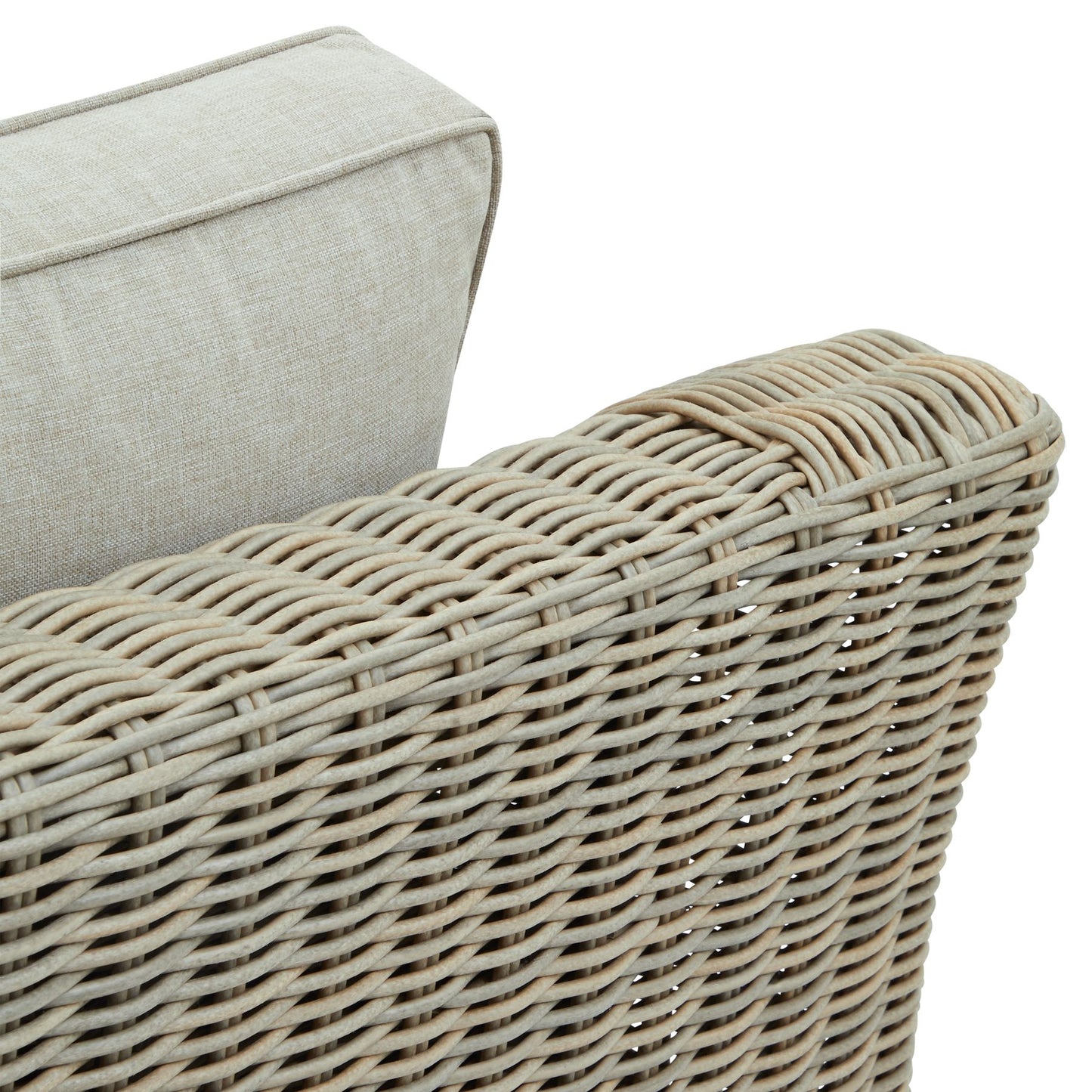 Close-up of a wicker chair with a beige cushion on a white background