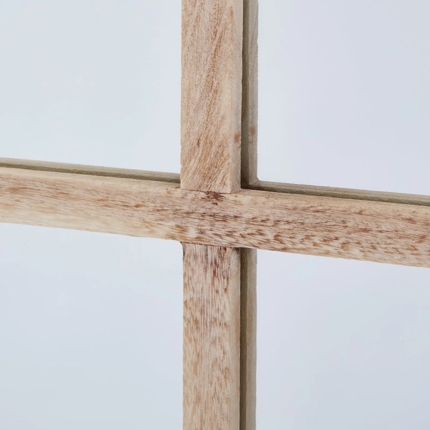 Close-up of a wooden cross against a white background