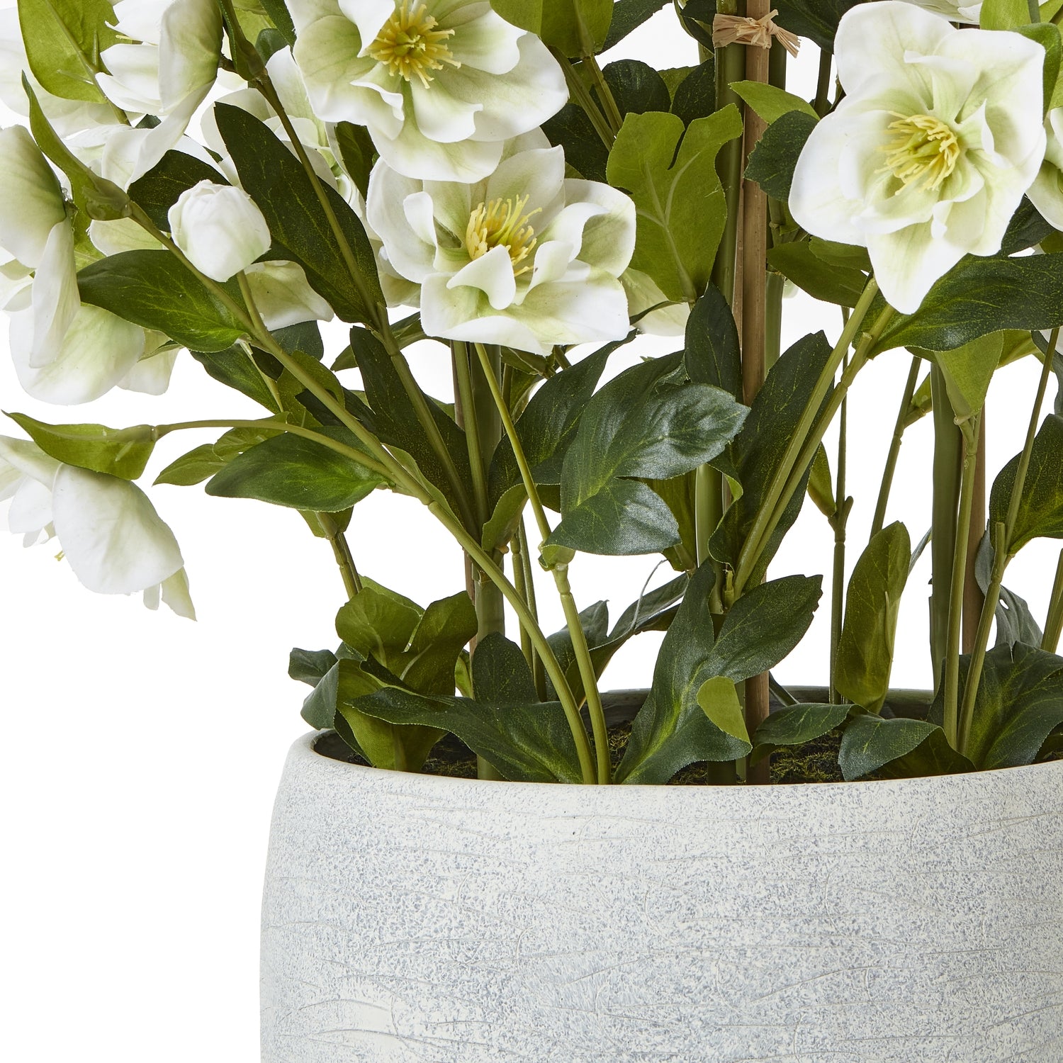 Artificial white flowers in a gray pot on a white background