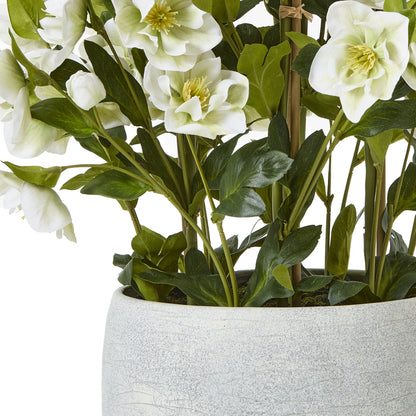 Artificial white flowers in a gray pot on a white background