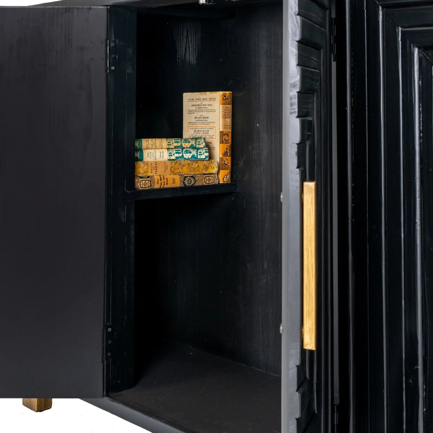 Black safe with open door revealing vintage books inside