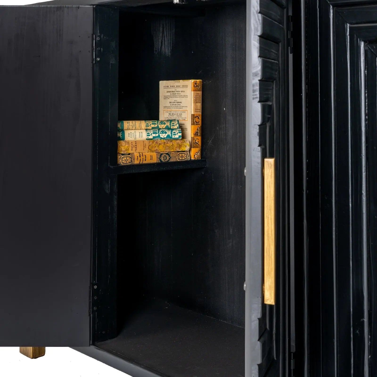 Black safe with open door revealing vintage books inside