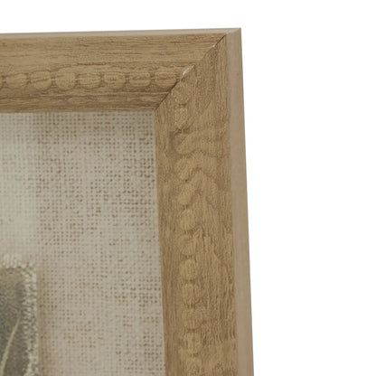 Close-up of a wooden picture frame with intricate carvings on a white background