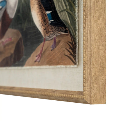 Close-up of a framed painting with a bird detail